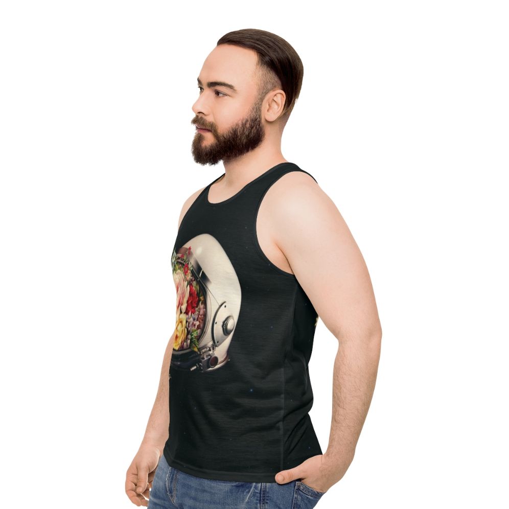 An astronaut in a space suit surrounded by flowers and stars on a cosmic, surreal tank top - men side