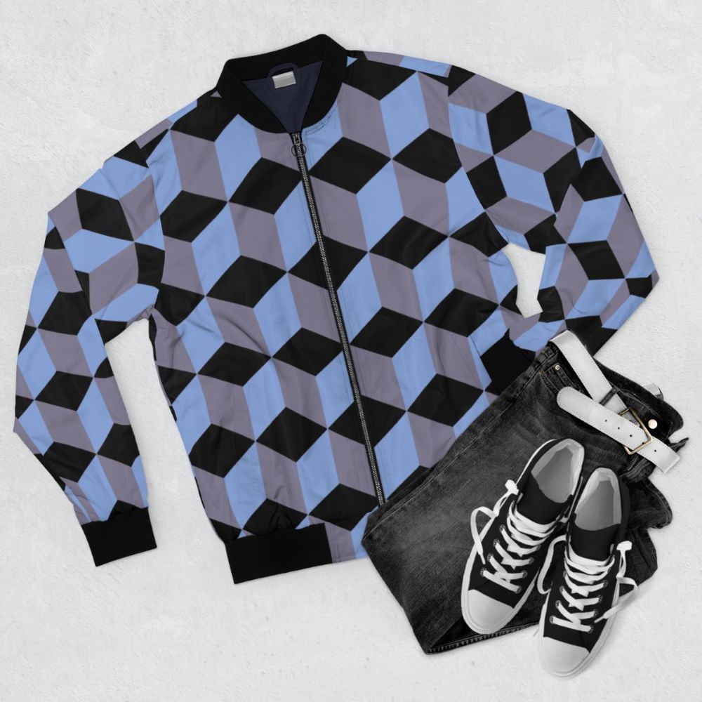 Bomber jacket with an isometric cube pattern in black, blue, and lilac colors, featuring a geometric art design with the illusion of depth. - Flat lay