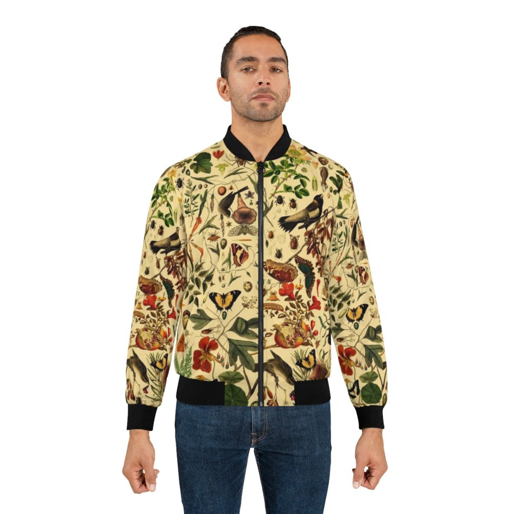 Vintage-style bomber jacket with a repeating pattern of biology-themed elements like plants, insects, and animals. - Lifestyle