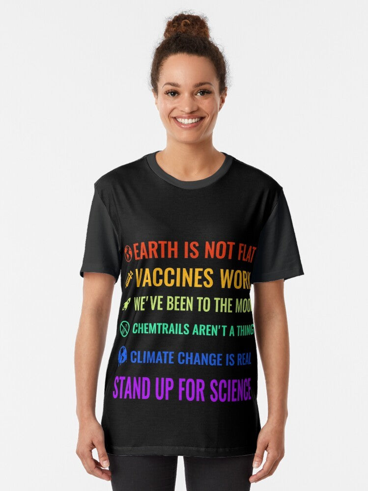 Graphic t-shirt with text "Earth is not flat! Vaccines work! We've been to the moon! Chemtrails aren't a thing! Climate change is real! Stand up for science!" - Women