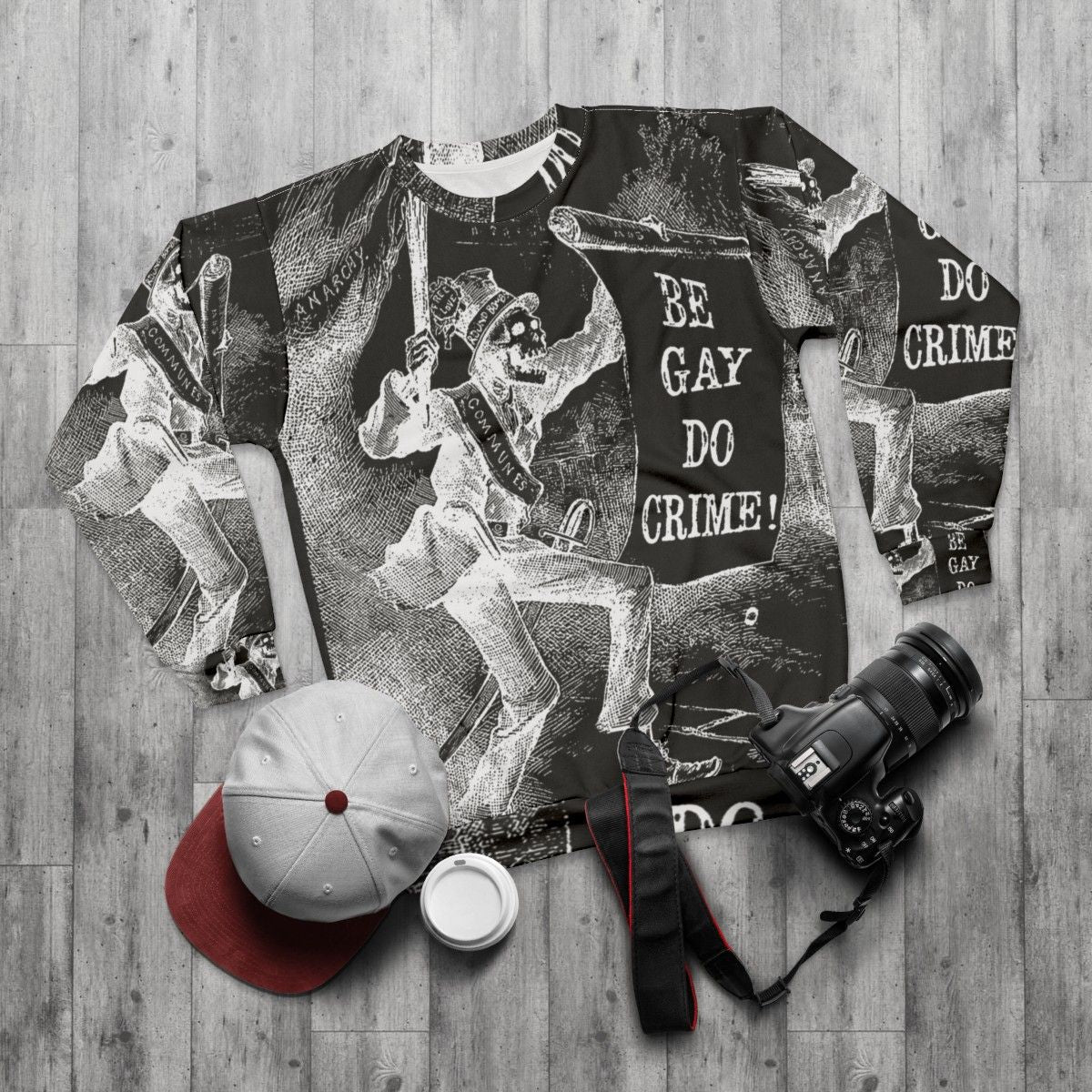 Skeleton sweatshirt with "Be Gay Do Crime" text and LGBTQ, anarchy, communist imagery - flat lay