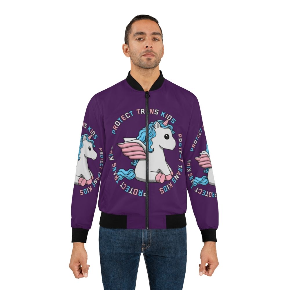 Colorful unicorn bomber jacket with trans pride colors, featuring the text "Protect Trans Kids" - Lifestyle