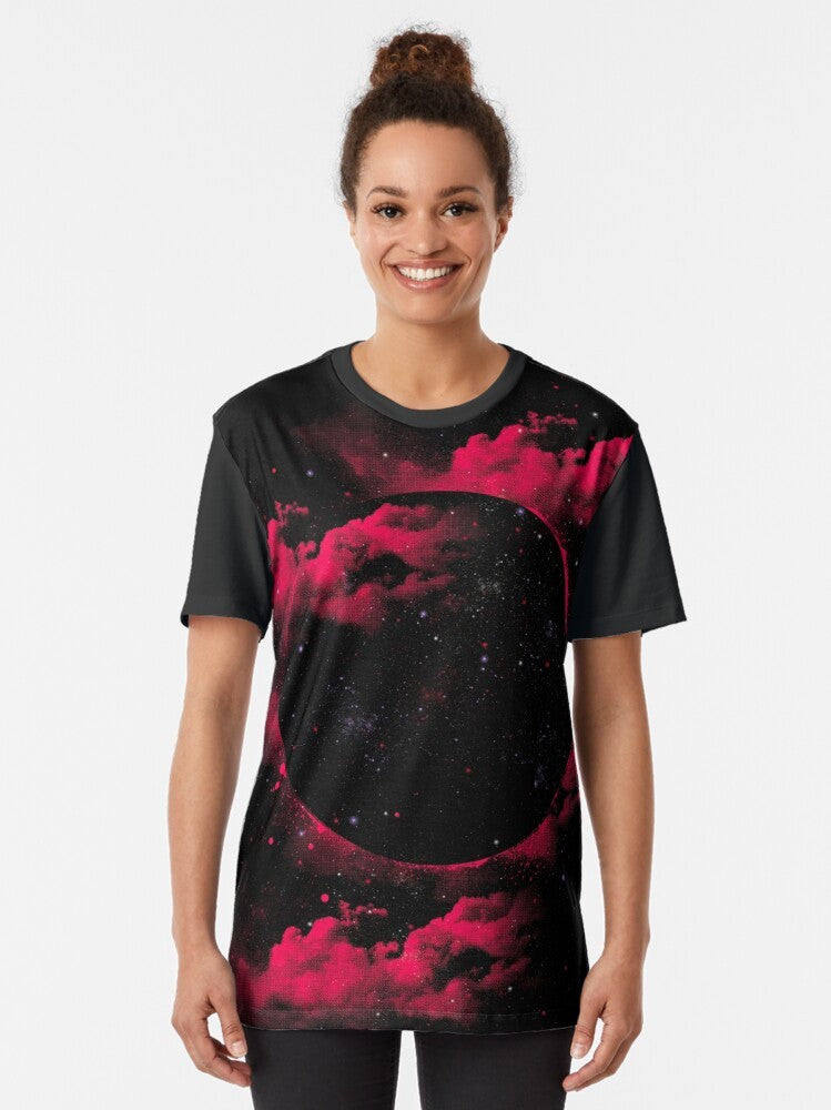 A stylish black t-shirt featuring a graphic design of a mesmerizing black hole in space, surrounded by stars and cosmic elements. - Women