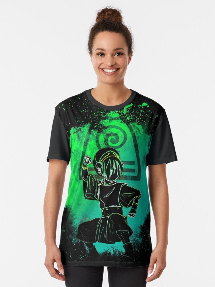 Colorful graphic t-shirt design featuring the silhouette of an earth bender from the Avatar: The Last Airbender cartoon series. - Women