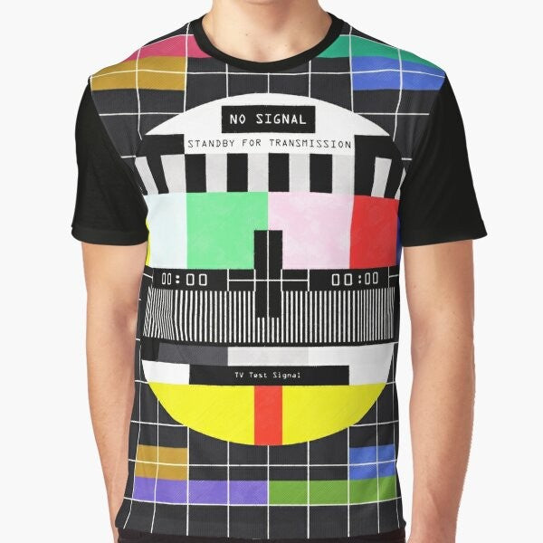 Graphic t-shirt design featuring a retro, glitchy "standby for transmission" message with vintage television and digital art elements.