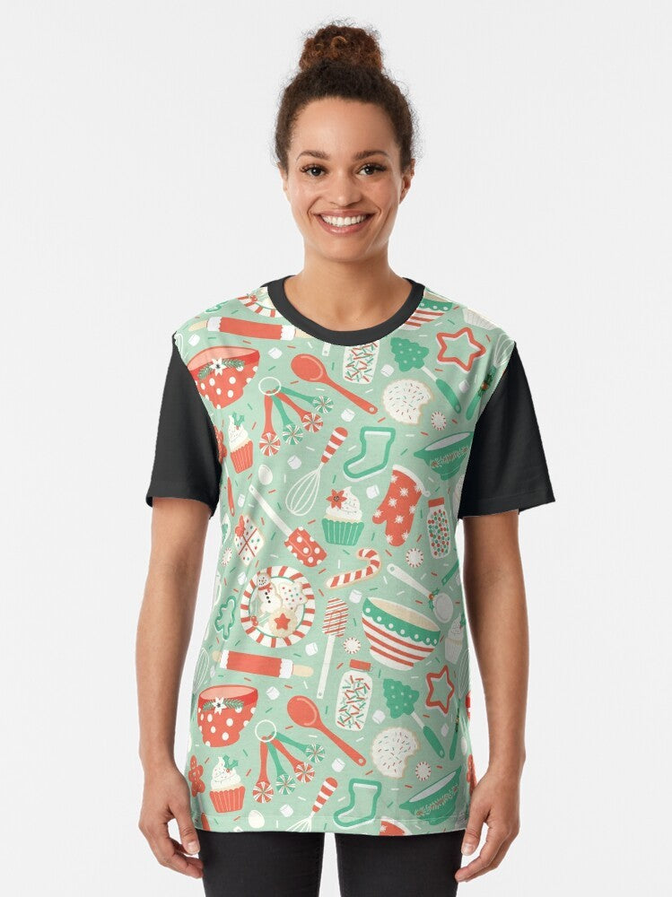 A vibrant graphic t-shirt featuring various Christmas baking elements like cookies, cupcakes, and candy canes. - Women