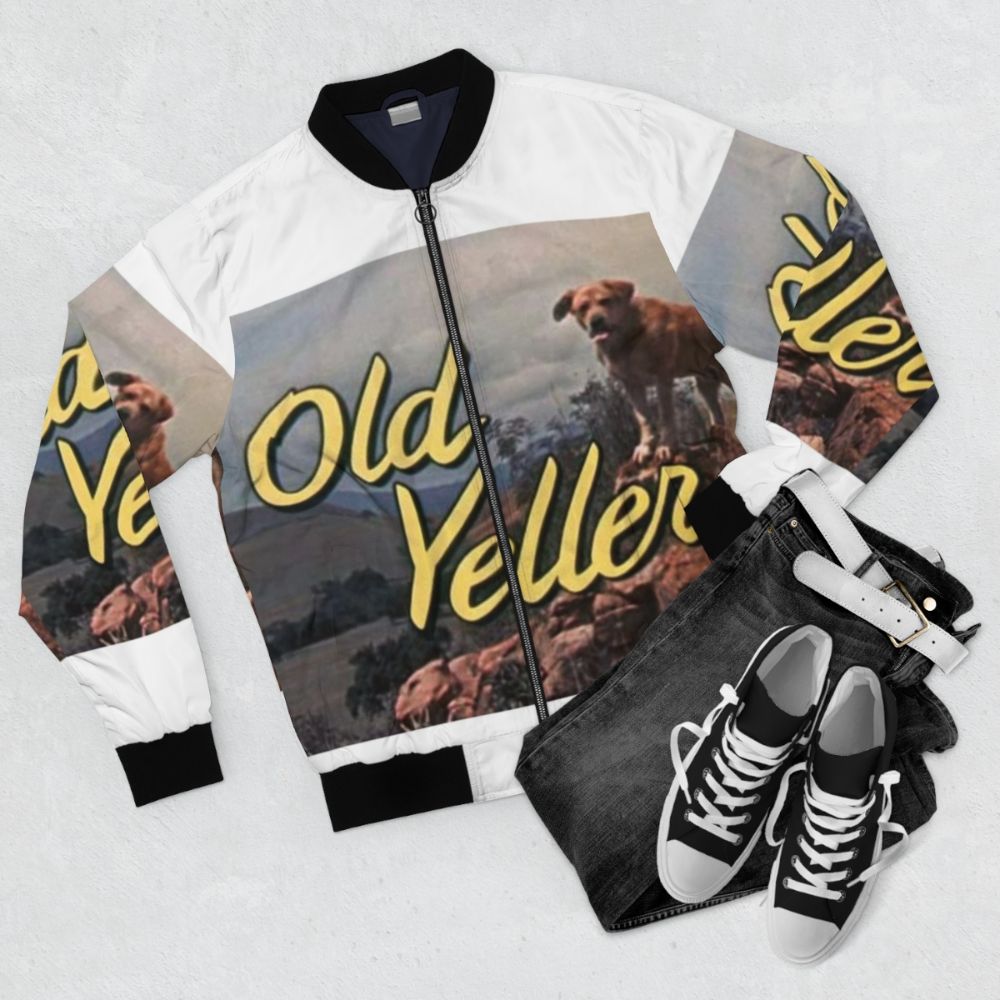 Vintage graphic "OLD YELLER" bomber jacket with retro typography and yellow color scheme - Flat lay