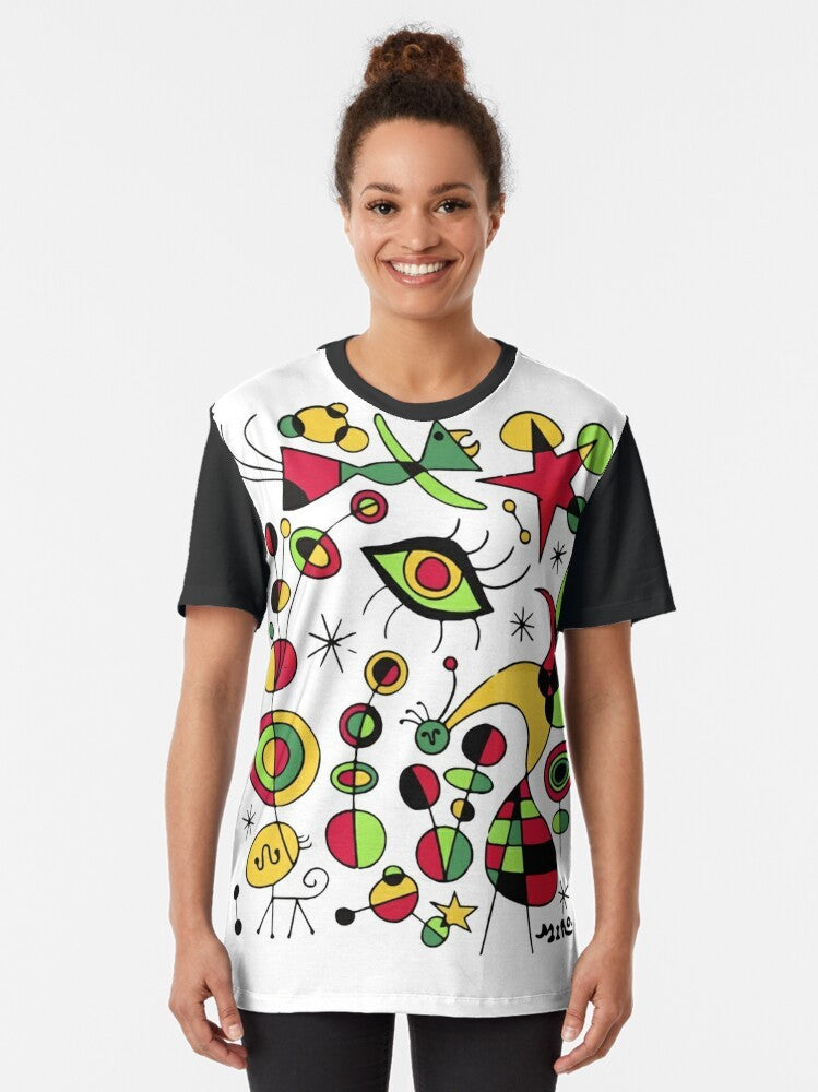 Joan Miro inspired t-shirt design featuring colorful fish in a surrealistic style - Women