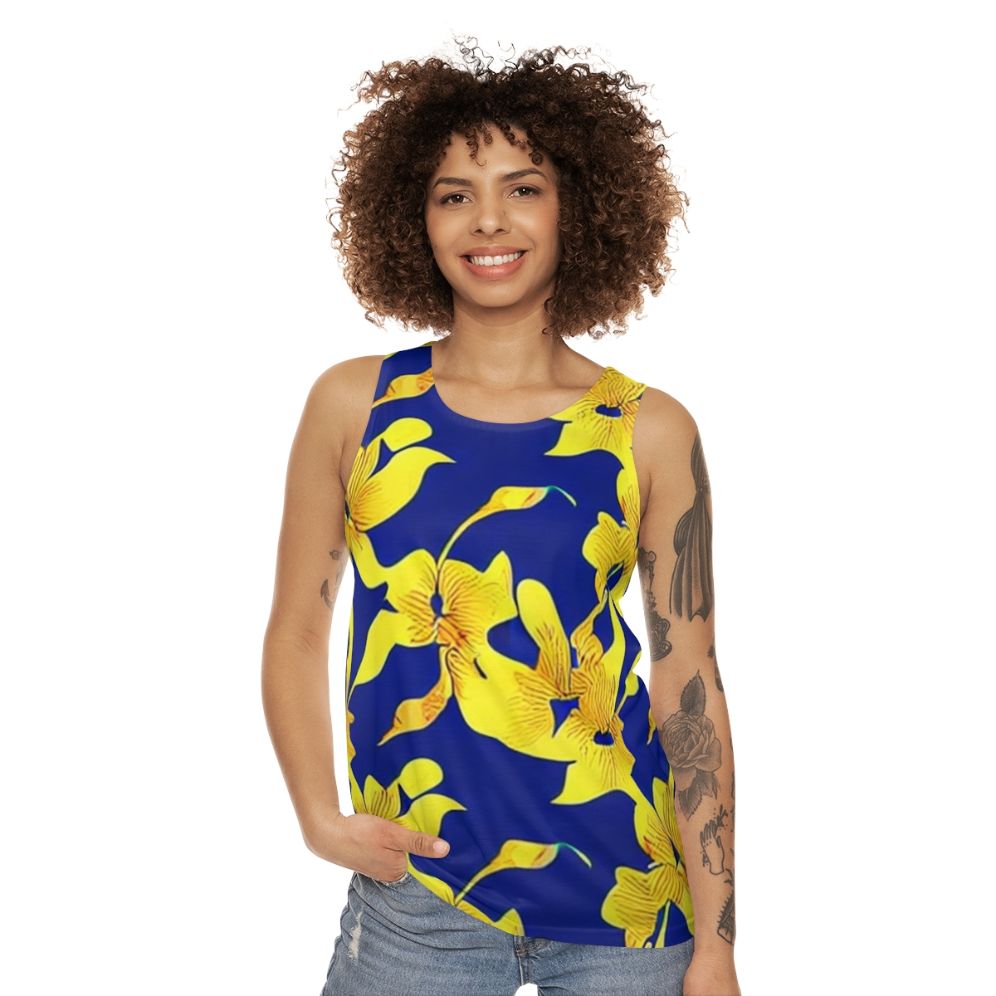 Abstract yellow floral pattern on blue unisex tank top - women