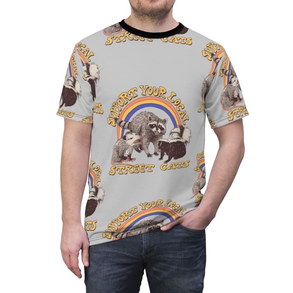 Retro-style AOP t-shirt featuring a colorful design of cats, possums, skunks, and raccoons in a fun, urban setting. - men front