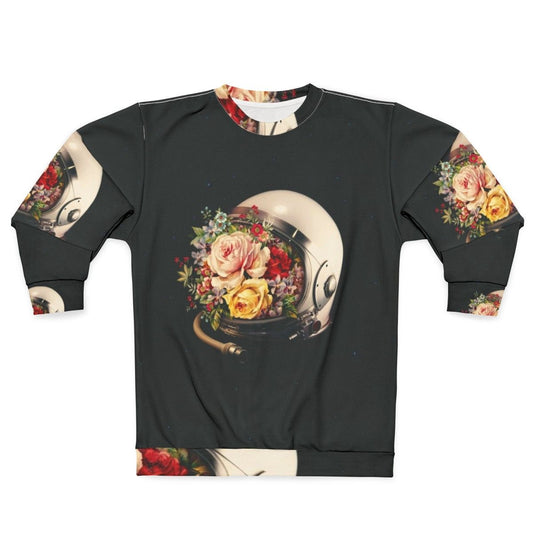 Celestial Bloom Astronaut Sweatshirt featuring a surreal collage of an astronaut, stars, and flowers