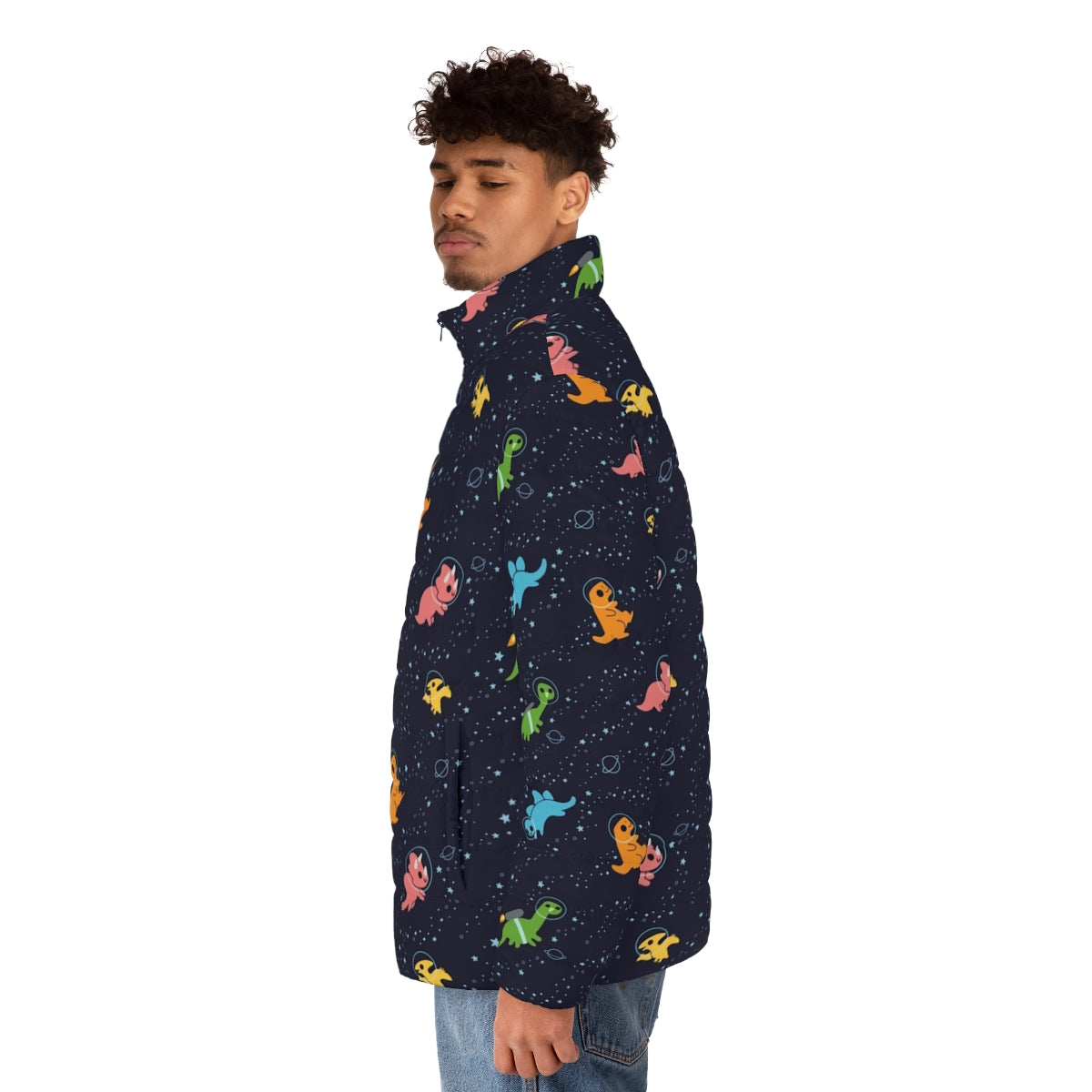 A puffer jacket featuring a whimsical pattern of dinosaurs floating in a galaxy of stars and planets. - men side left