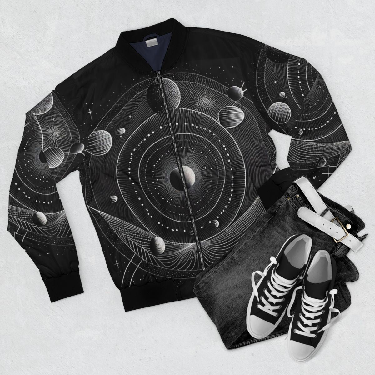 Bomber jacket with a geometric solar system design in black and white - Flat lay