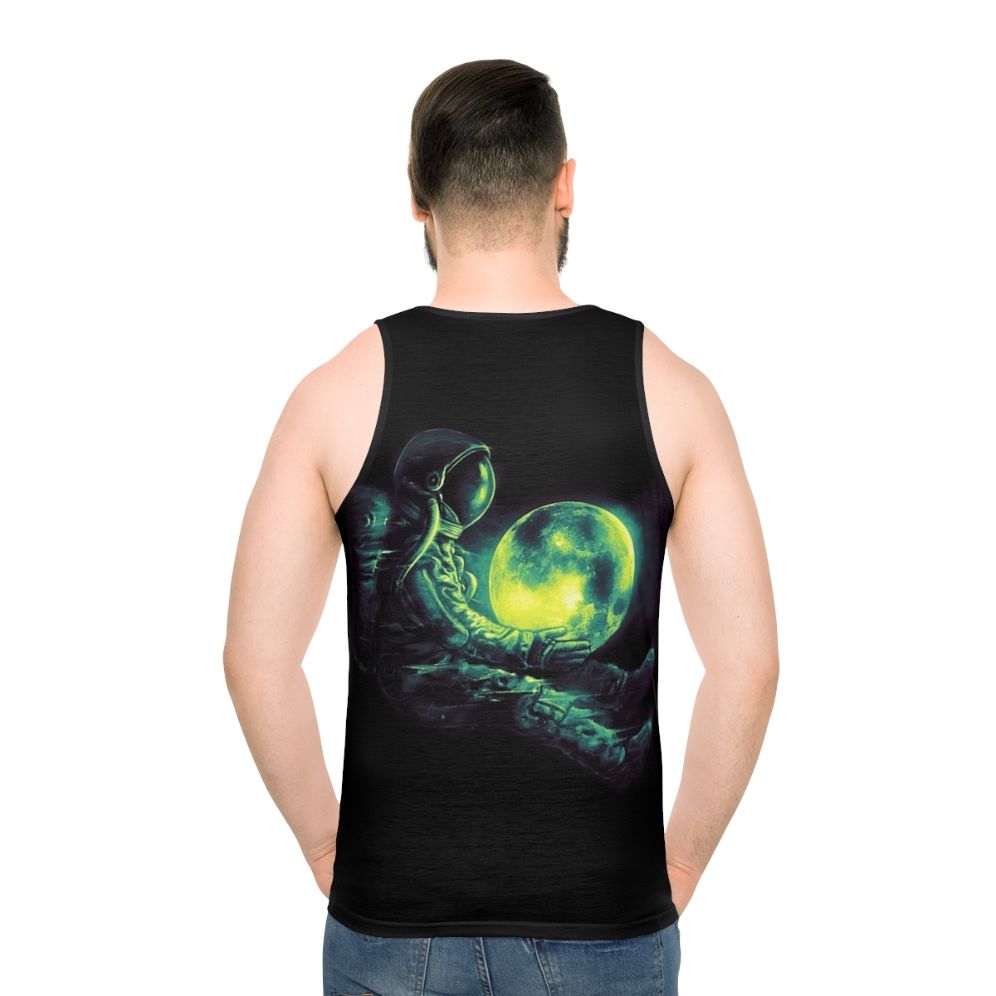 Unisex tank top with a cosmic, galactic design featuring a moon and astronaut - men back