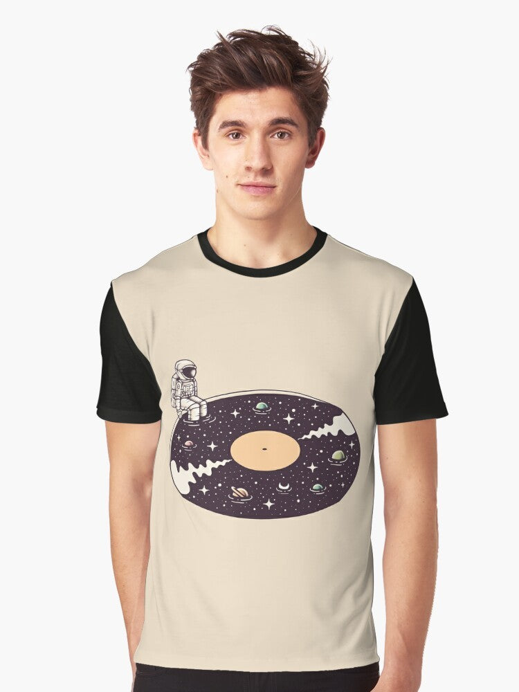 Cosmic Sound Graphic T-Shirt featuring a surreal design of an astronaut, stars, planets, and vinyl record - Men