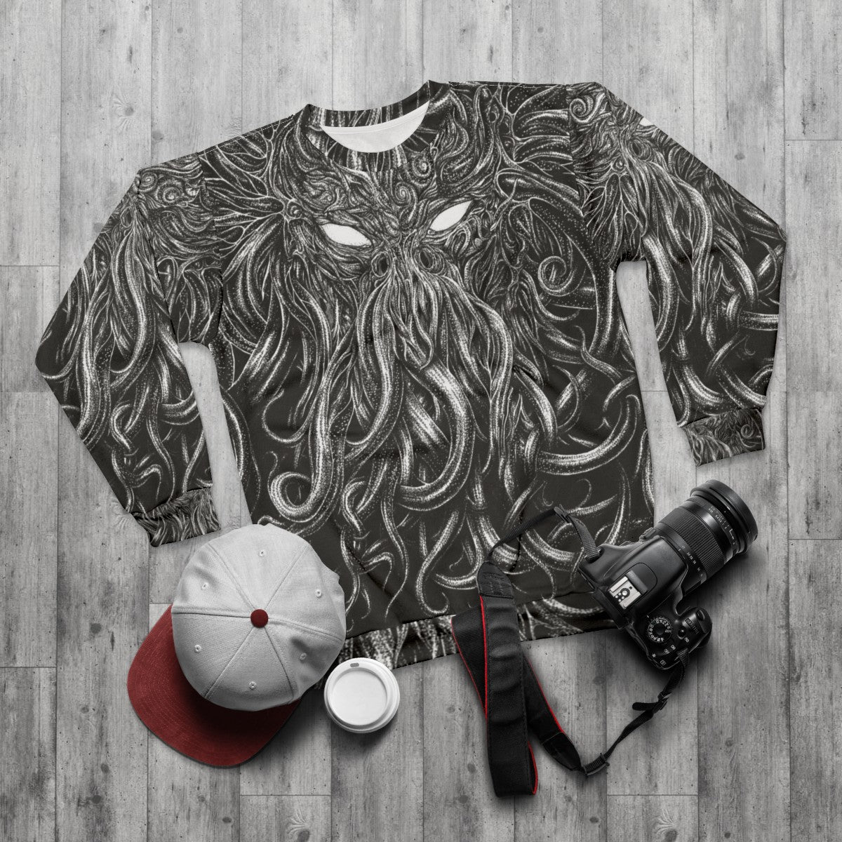 Black sweatshirt with Lovecraft and Cthulhu inspired design - flat lay