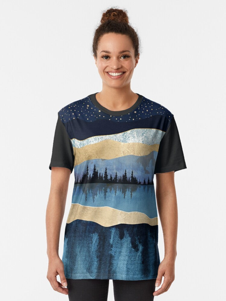 Midnight Lake Graphic T-Shirt featuring a serene abstract landscape with a night sky, trees, and water reflection - Women