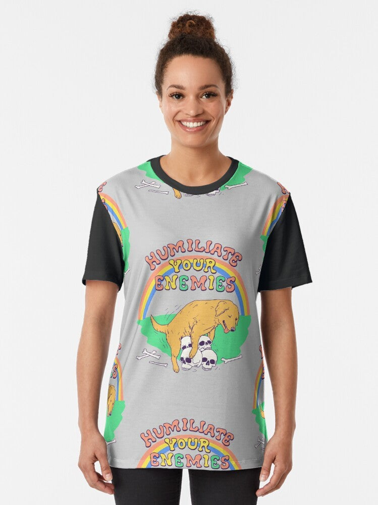 Graphic t-shirt with the words "Humiliate Your Enemies" and a victory-themed design featuring dogs, skulls, and rainbows - Women