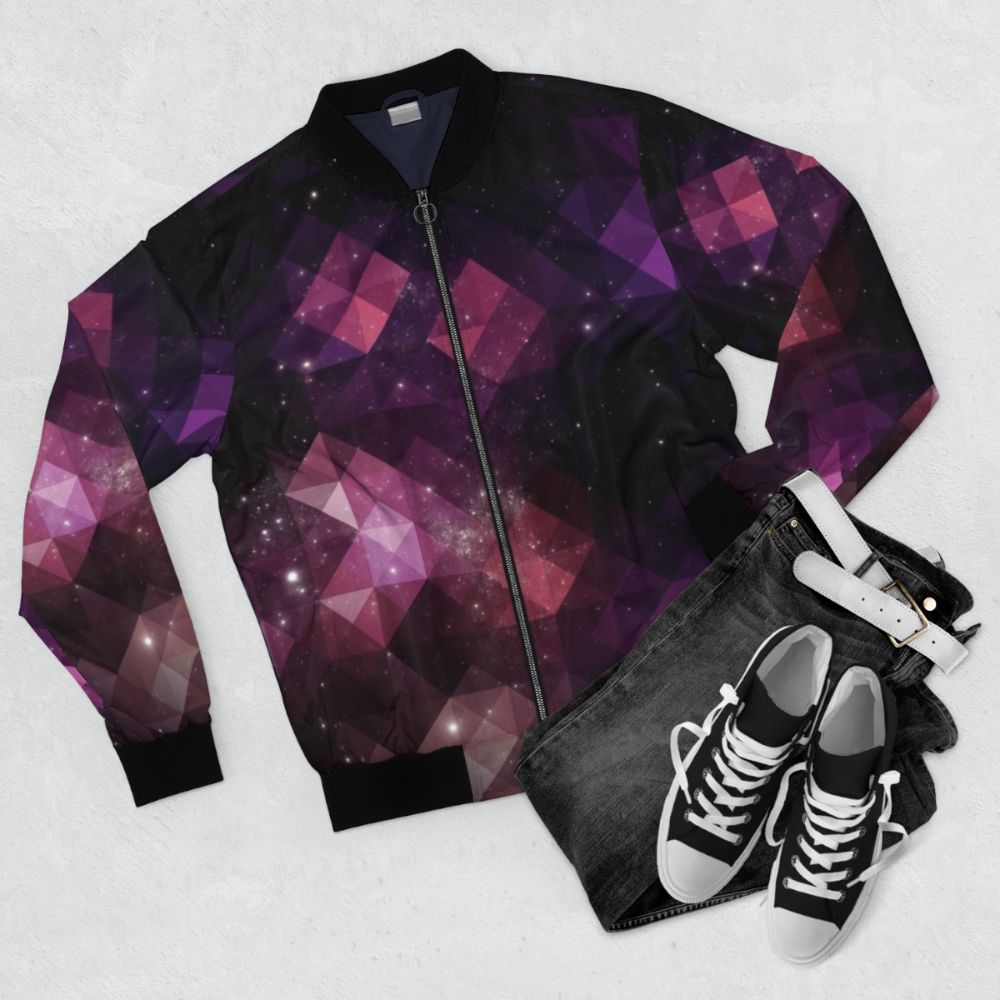 Cosmic Geometric Space Bomber Jacket with triangle and star pattern in pink, black, and purple colors - Flat lay