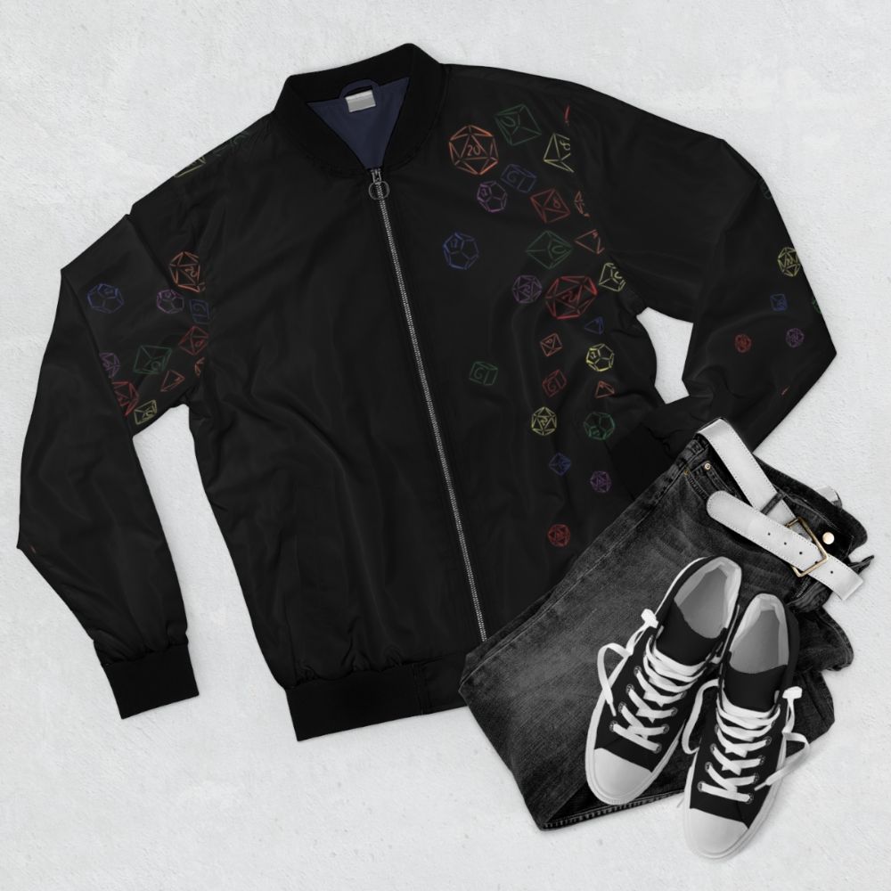 Colorful rainbow-patterned bomber jacket with dice print, ideal for gamers and TTRPG enthusiasts. - Flat lay