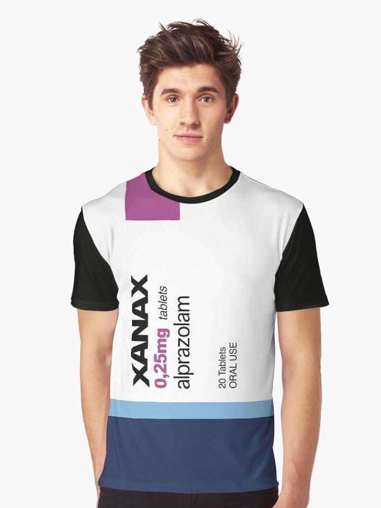 A graphic t-shirt featuring the word "XANAX" in a bold, stylized font, surrounded by various meme-inspired elements like rainbows, pods, and avocados. - Men