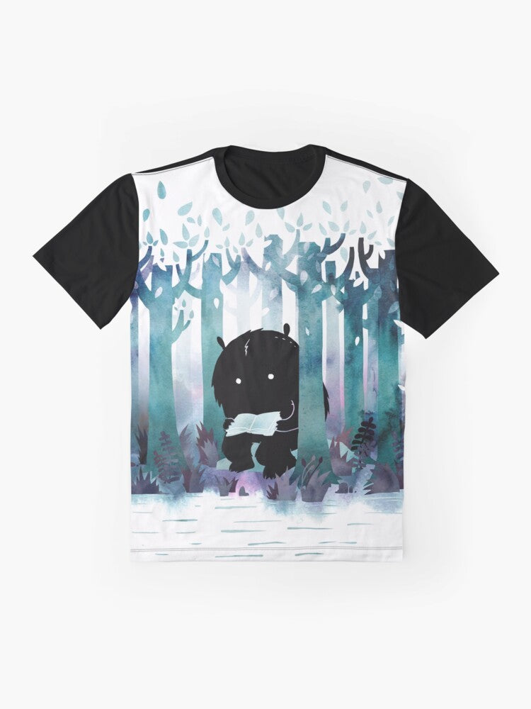 Whimsical "A Quiet Spot" graphic t-shirt featuring a watercolor monster reading books in a forest setting - Flat lay