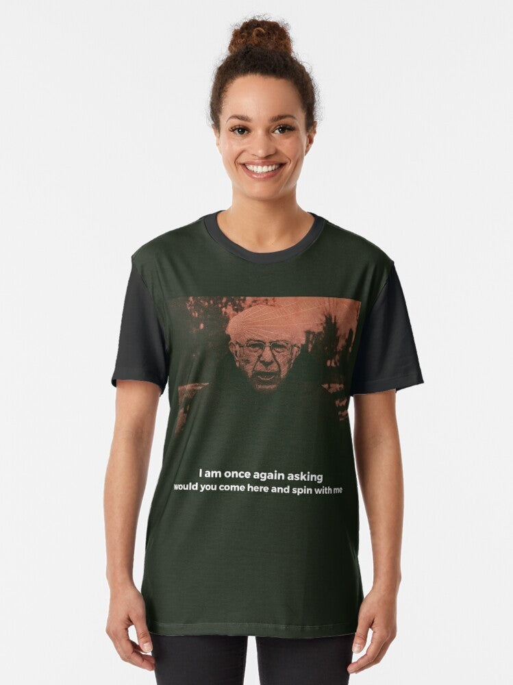 A graphic t-shirt featuring Bernie Sanders with a "Turnover" design and the text "Peripheral Vision", "Dizzy on the Comedown", and "Emo/Indie" style elements. - Women