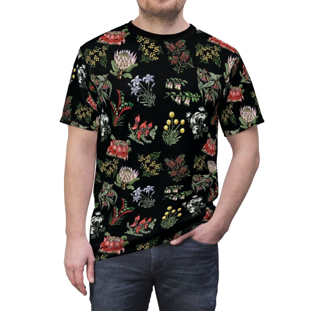 Lino print t-shirt featuring a colorful arrangement of native Australian flowers including wattle, flowering gum, and kangaroo paw. - men front