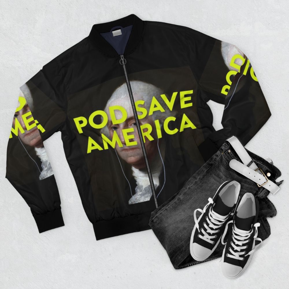 "Pod Save America logo bomber jacket with George Washington design" - Flat lay