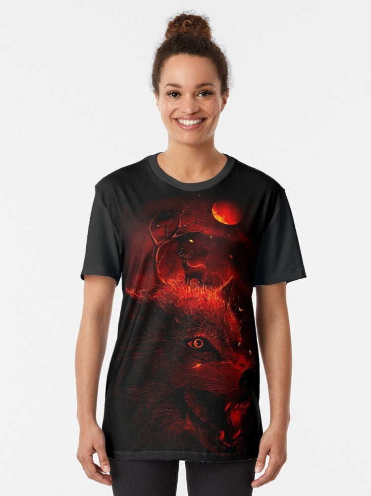 A striking red wolf silhouette against a dark, nature-inspired background on a graphic t-shirt. - Women