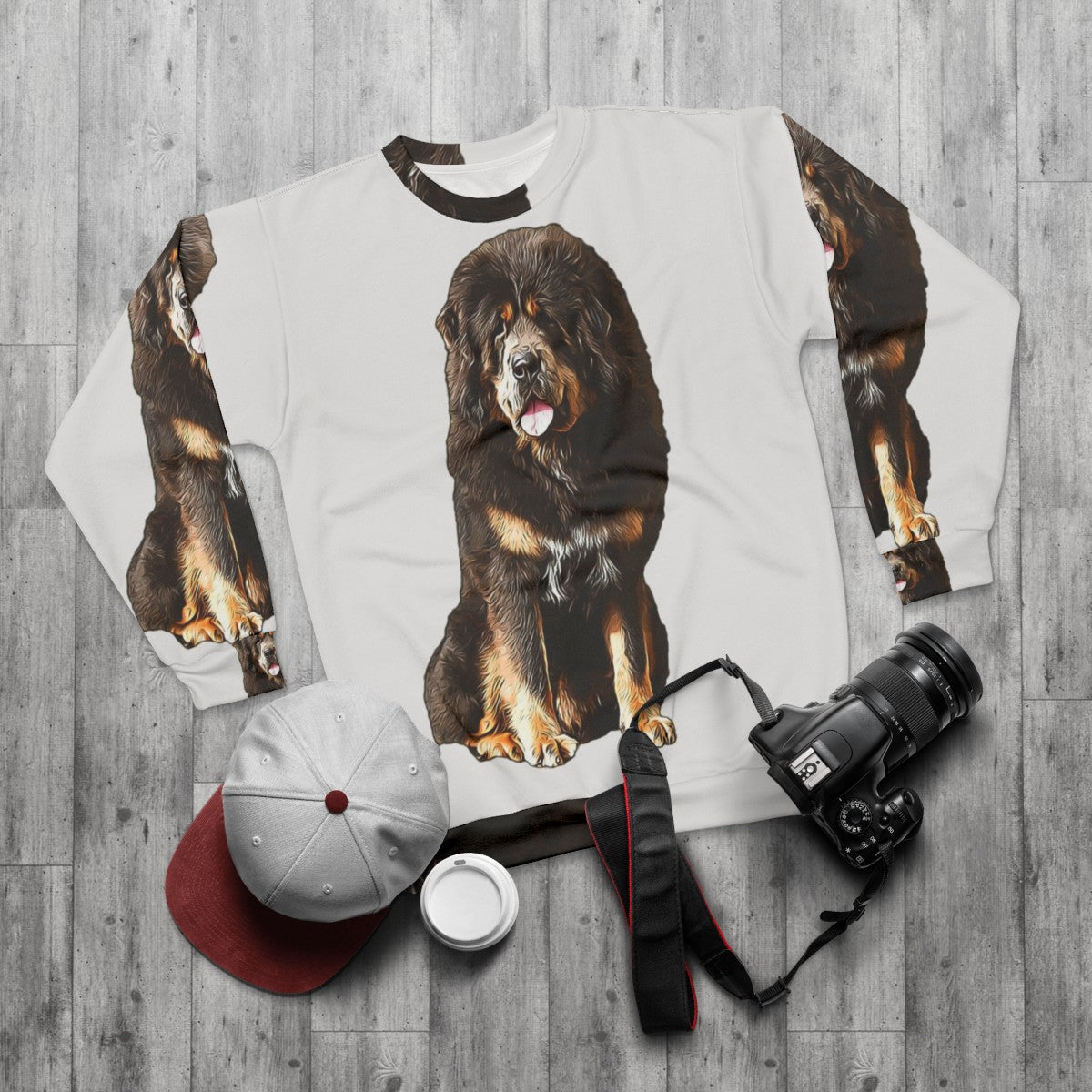 Tibetan Mastiff wearing a cozy animal print sweatshirt - flat lay