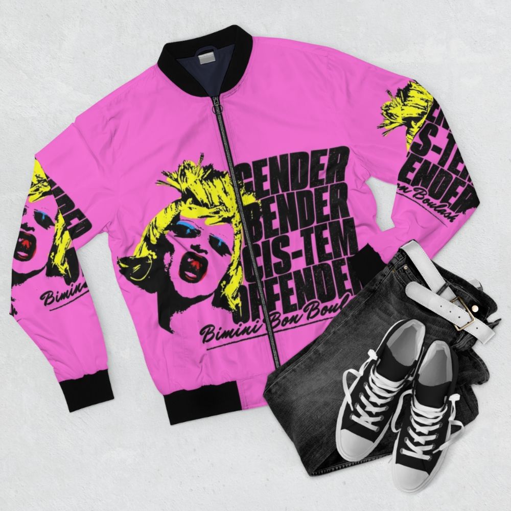 Colorful bomber jacket with "CIS-TEM OFFENDER" pop art design, featuring Bimini Bon Boulash from RuPaul's Drag Race UK - Flat lay