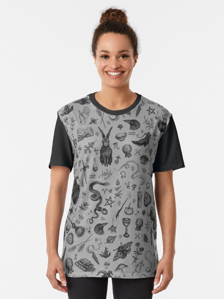 A graphic t-shirt featuring a salem witch design with a rabbit, snake, and crow in a spooky, gothic style. - Women