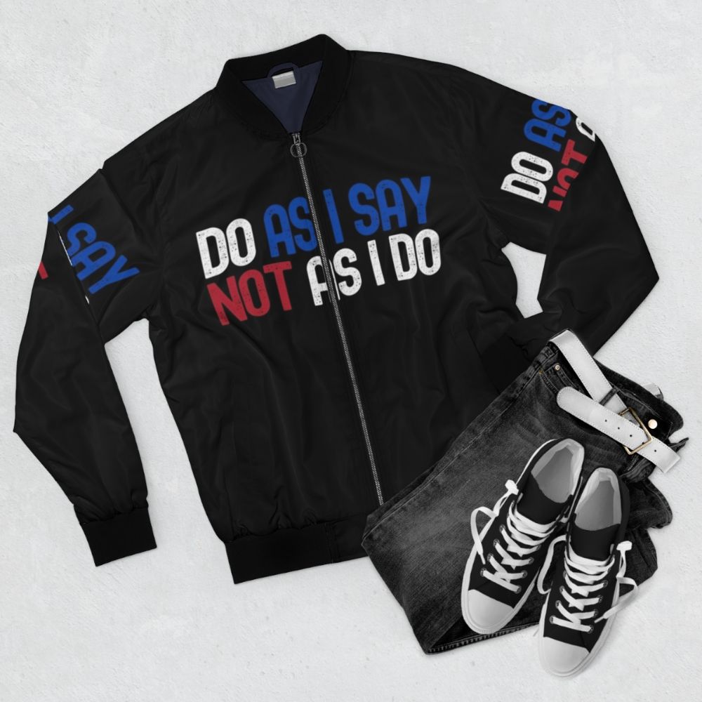 "Hypocritical Politics" bomber jacket with text and political imagery - Flat lay