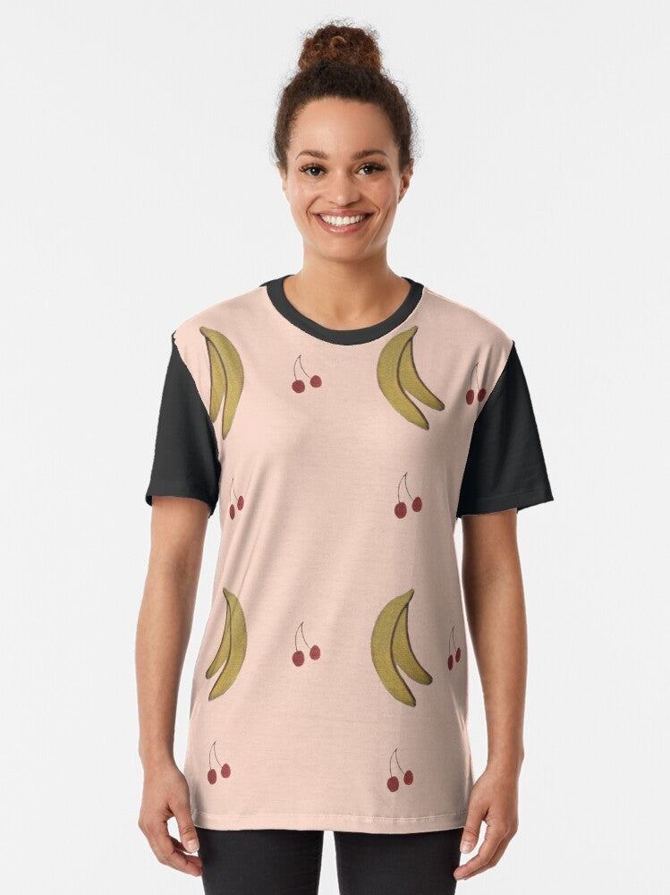 LA PETITE VIE graphic t-shirt featuring a colorful pattern of bananas, cherries, and other Quebec-inspired elements - Women