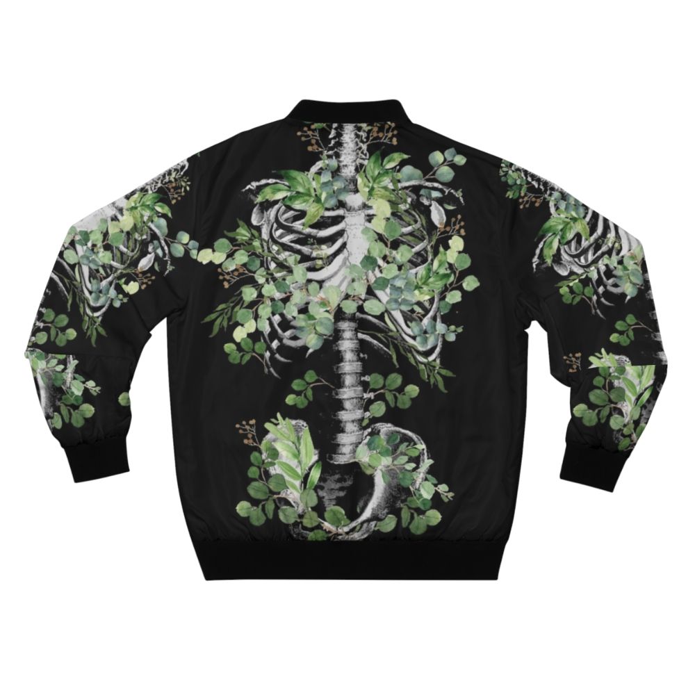 Botanical skeleton bomber jacket featuring rib cage, pelvis, and eucalyptus leaves floral design - Back