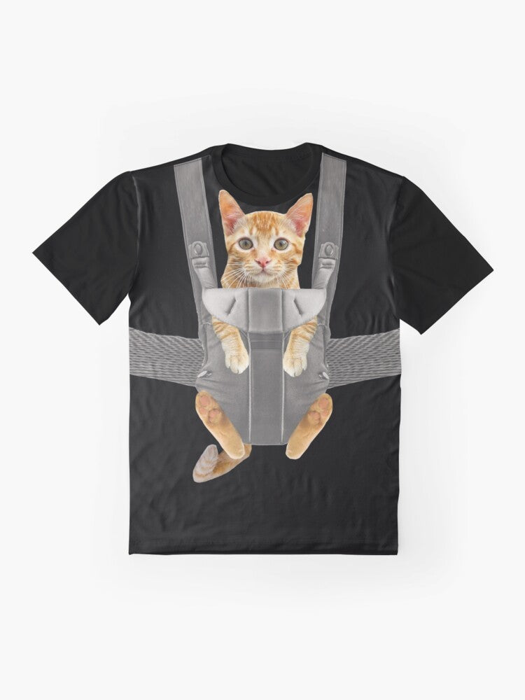 Monty the Funny Orange Cat in a Baby Carrier Graphic T-Shirt - Flat lay