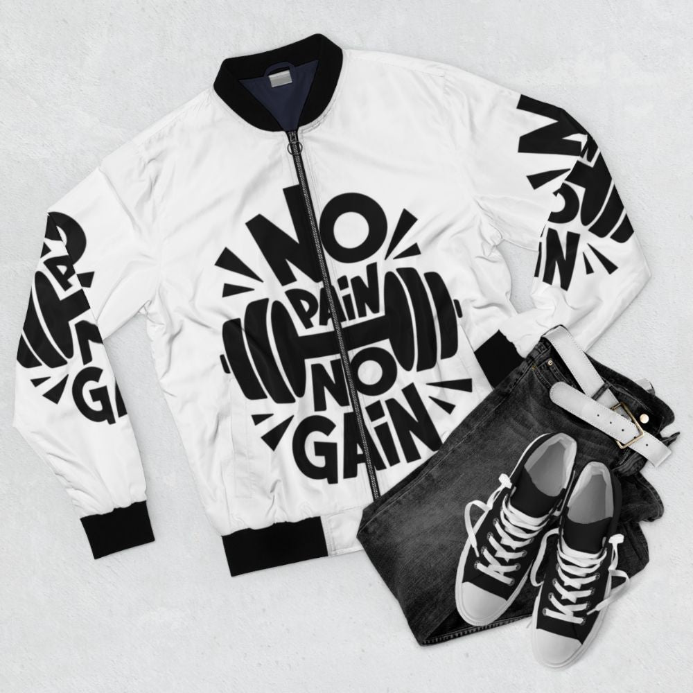 Motivational bomber jacket with text 'Pure motivation' and fitness icons - Flat lay