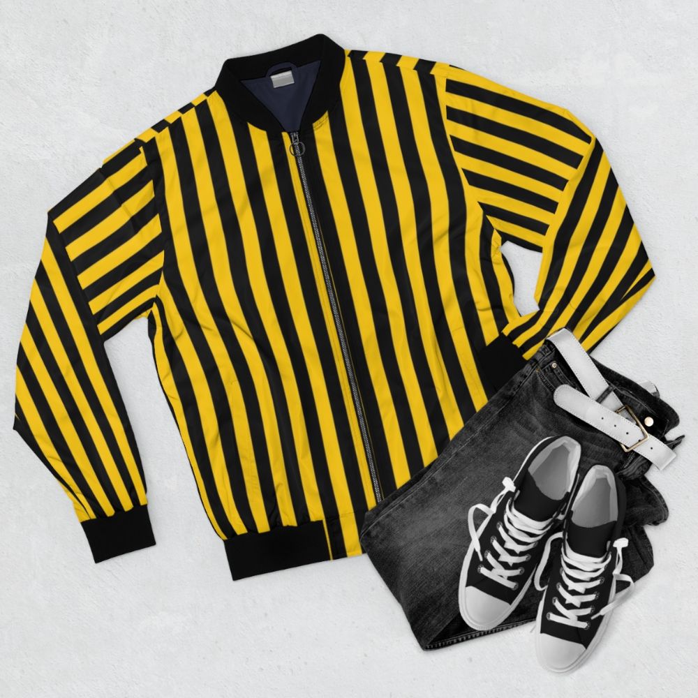 Yellow and black striped bomber jacket with a stylish and fashionable design - Flat lay