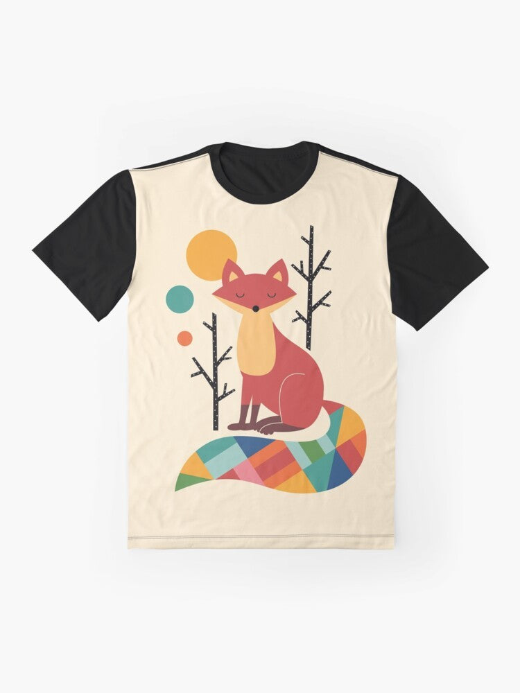 A colorful graphic t-shirt featuring a vibrant rainbow fox in a natural forest landscape. - Flat lay