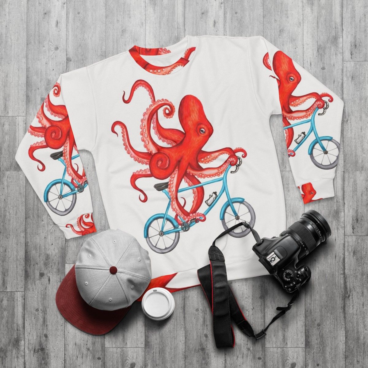 Cycling octopus graphic on a sweatshirt - flat lay