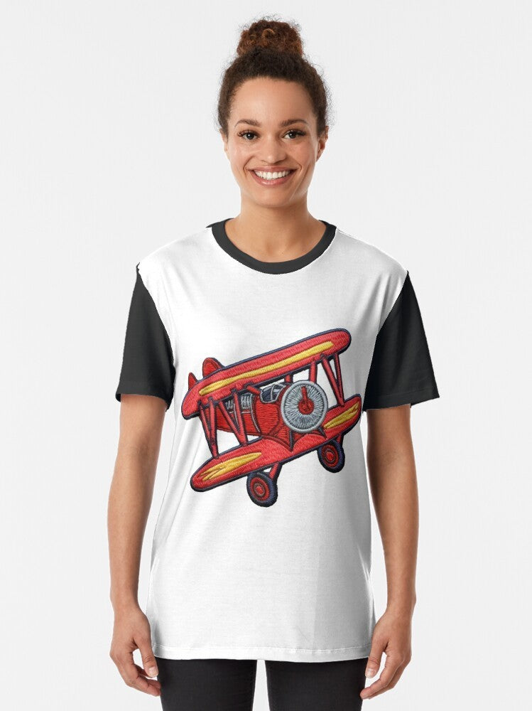 Embroidered airplane graphic t-shirt featuring a crop duster plane and pilot's patch design - Women