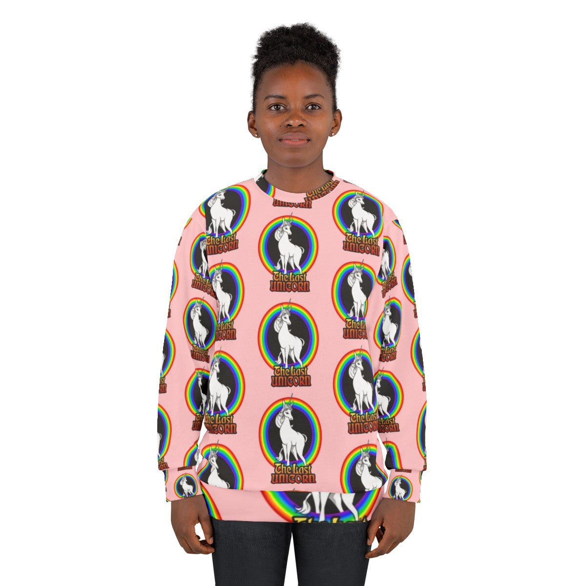 The Last Unicorn rainbow sweatshirt with a white unicorn and rainbow design - women