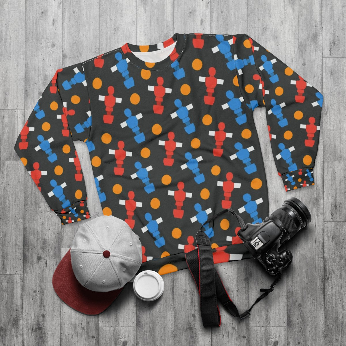 Table football players and ball design on a sweatshirt - flat lay