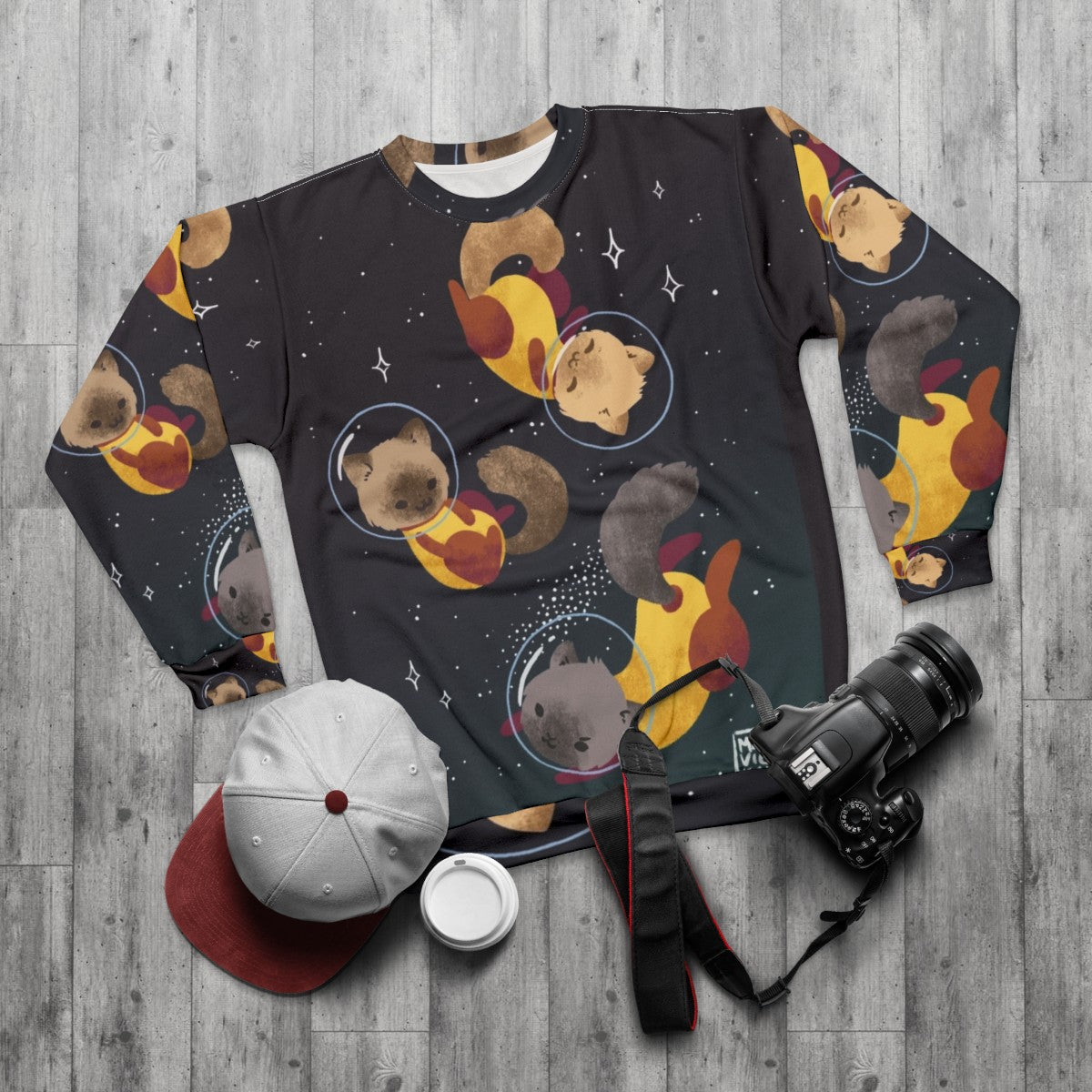 Space cats cosmic sweatshirt with galaxy print design - flat lay