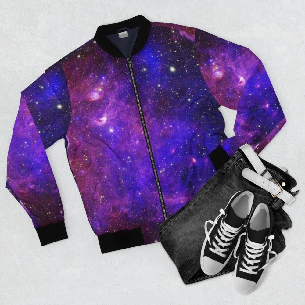 Galaxy design bomber jacket with vibrant cosmic patterns and stars - Flat lay