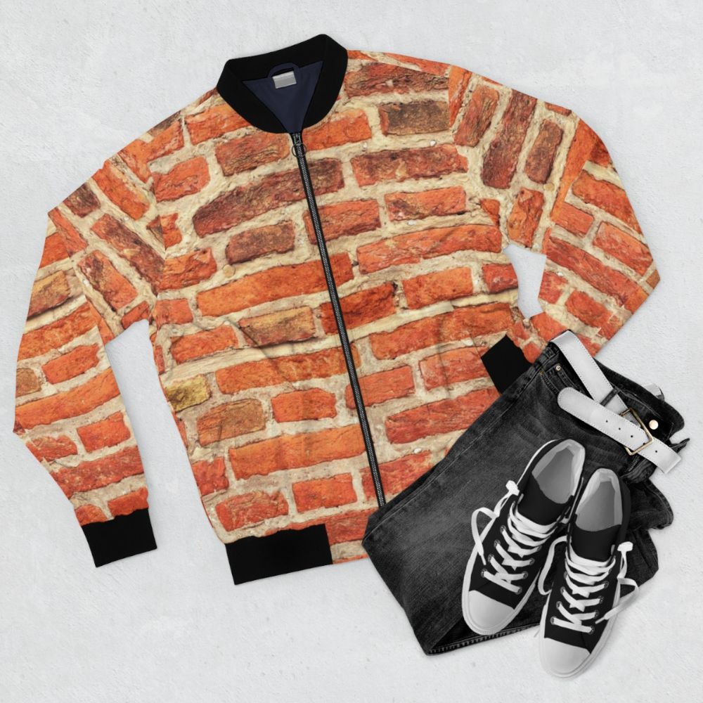 Red vintage bomber jacket with a brick wall pattern design - Flat lay