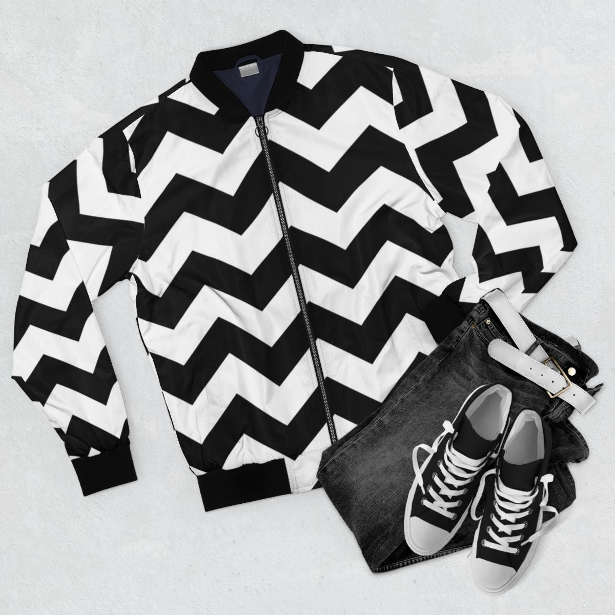 Sleek and stylish zig zag pattern bomber jacket in classic black and white colors. - Flat lay