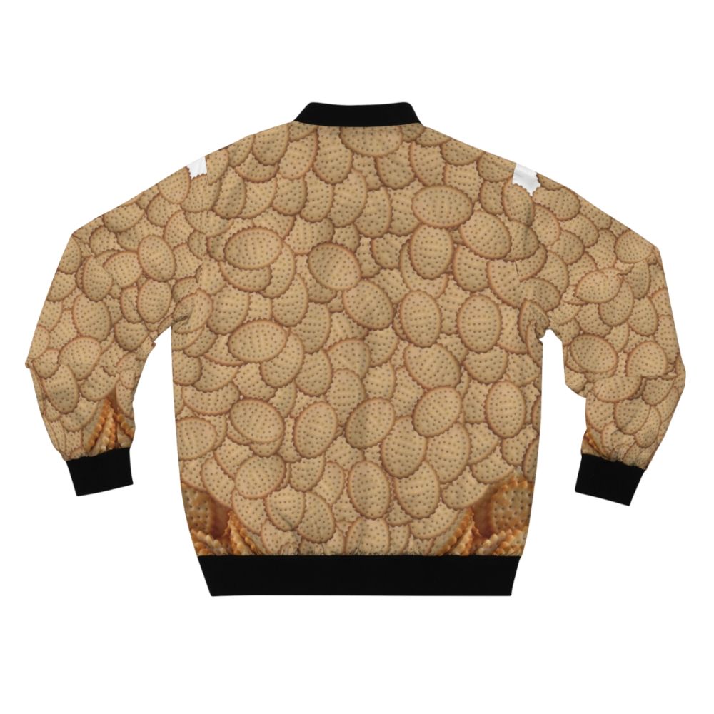 A bomber jacket featuring a collage design of chicken crimpy shapes, Arnotts biscuits, and crimpies. - Back