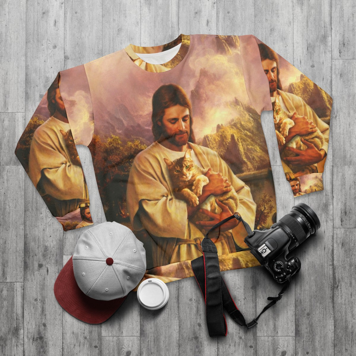 The Cat of Christ Christian Sweatshirt with a cat dressed as Jesus - flat lay